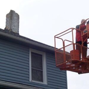 Worker on Cherry Picker for Chimney Repair