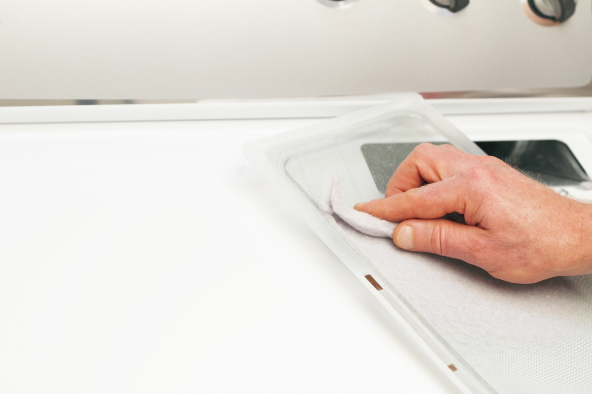 Man Cleaning Dryer Lint Out of Trap