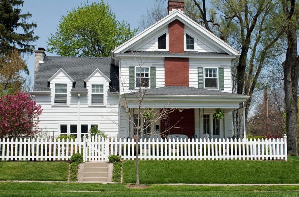 White Home Featuring a Prominent Chimney
