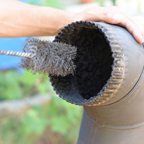 hand sweeping chimney exhaust