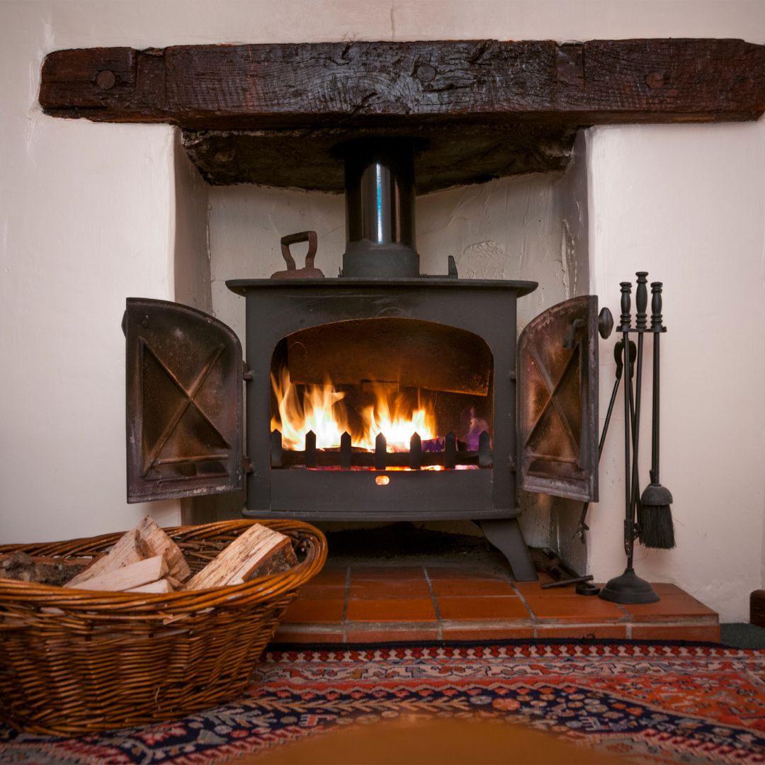 wood-burning stove in the center of a room