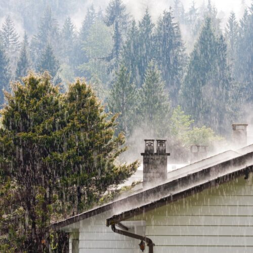 Raining over a house with a chimney