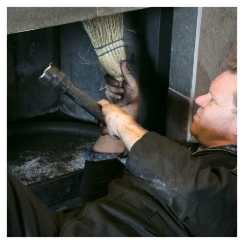 inspecting a fireplace chimney