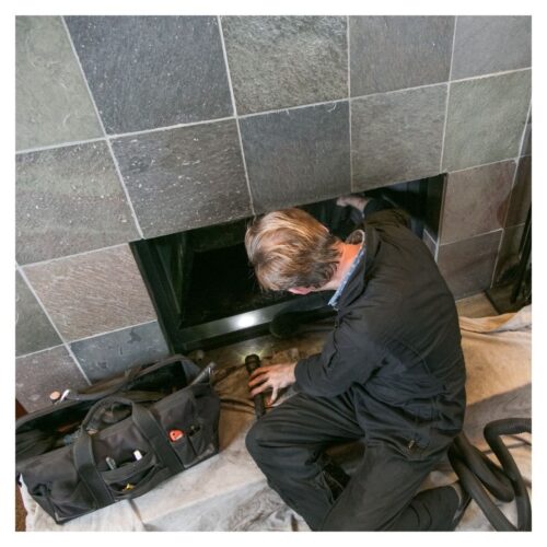 inspecting fireplace damper